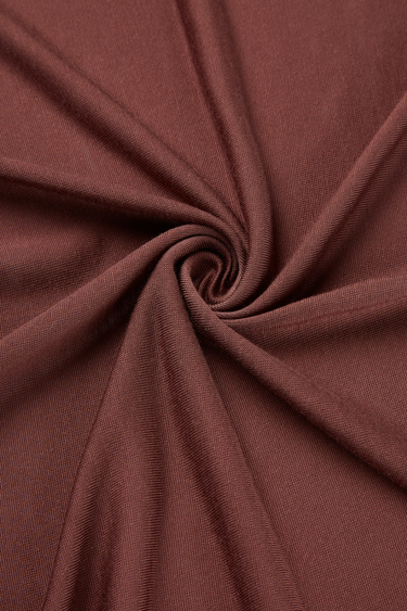 Lenzing TENCEL Lyocell single jersey fabric close-up with twist detail and soft flowing texture for premium summer apparel.