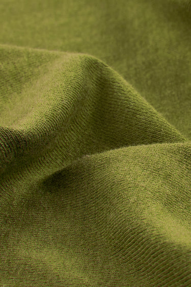 Mousse acrylic cashmere rib knit fabric close-up with surface drape detail and silk-like hand feel for premium casualwear.