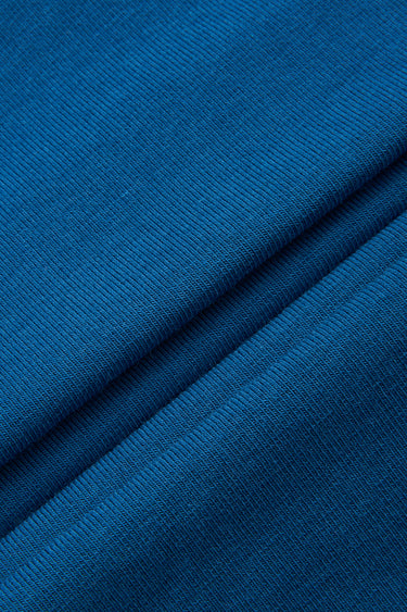 Mousse rib knit fabric close-up with surface fold detail and soft micro-fleece texture for modern casualwear.