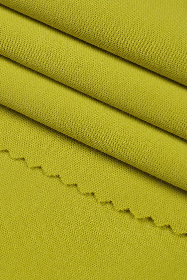 Long staple cotton double knit fabric close-up with surface fold detail and soft hand feel for casual knitwear and spring apparel.