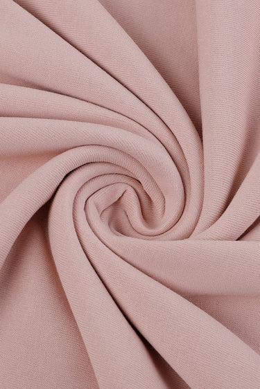 Viscose polyester single jersey fabric close-up with twist detail and fluid drape for spring-summer knitwear and everyday garments.