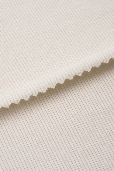 Ecosil biodegradable stretch rib knit fabric close-up with edge structure detail and smooth surface for comfortable knitwear.