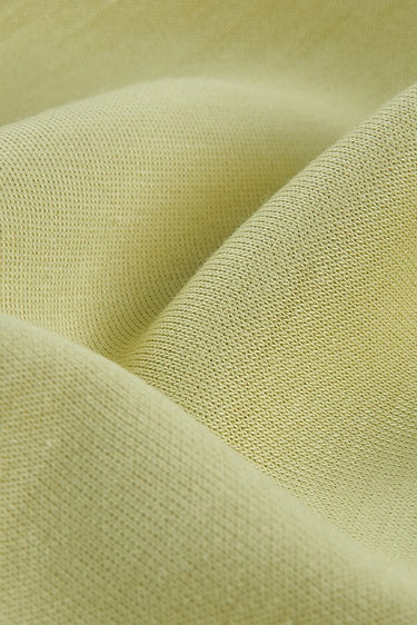 Double-face SCUBA air-layer knit fabric close-up with surface drape detail for hoodies and premium casual knitwear.