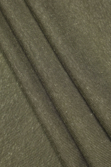 TENCEL linen blend stretch rib knit fabric close-up with surface fold detail and natural dry texture for lightweight tops and summer knitwear.