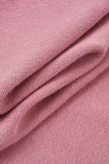 Mousse acrylic cashmere rib knit fabric close-up with surface fold detail and soft micro-fleece texture for modern casualwear.