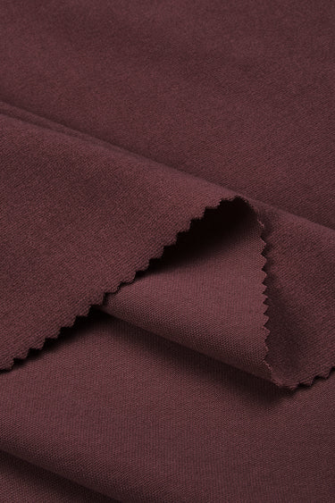 Ecocosy antibacterial acrylic cashmere fleece knit fabric close-up with folded edge detail and soft micro-fleece texture for modern casualwear.