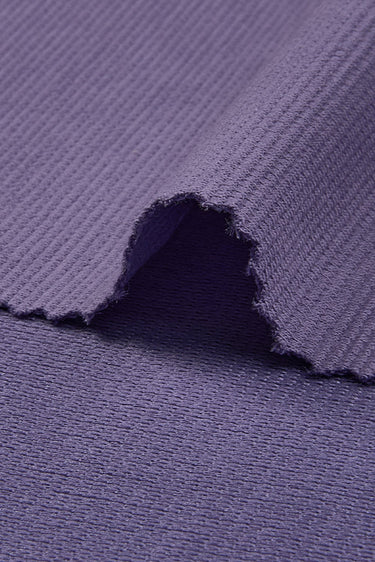 Stretch double-face step knit fabric close-up with edge structure detail and subtle textured surface for modern casual garments.