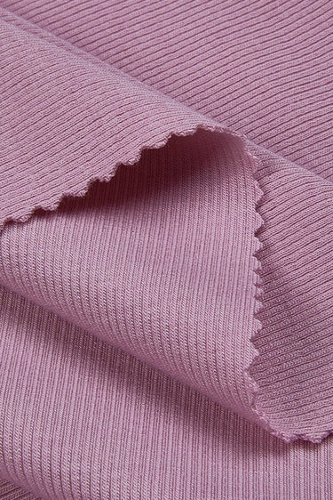 Mousse cashmere warm stretch rib knit fabric close-up with edge structure detail and soft texture for cooler-weather knit garments.