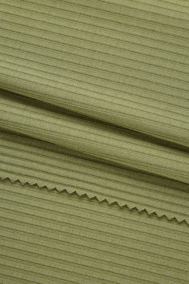 Viscose nylon spandex rib knit fabric close-up with deep rib texture and soft hand feel for fitted knit garments.