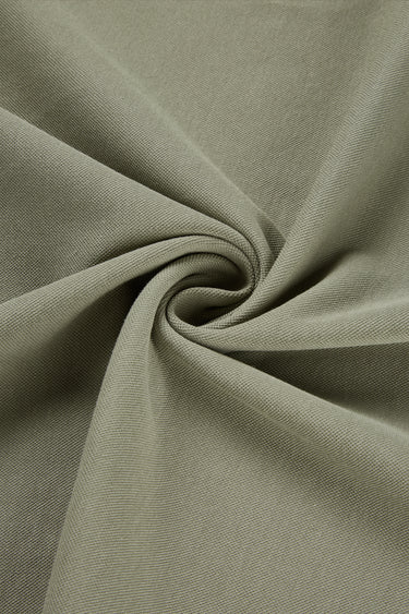 Quick-drying piqué knit fabric close-up with twist detail and subtle textured surface for polo shirts and casual tops.