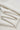 Sand-washed Lenzing modal stretch double knit fabric close-up with folded drape detail for sweatshirts and durable everyday knitwear.
