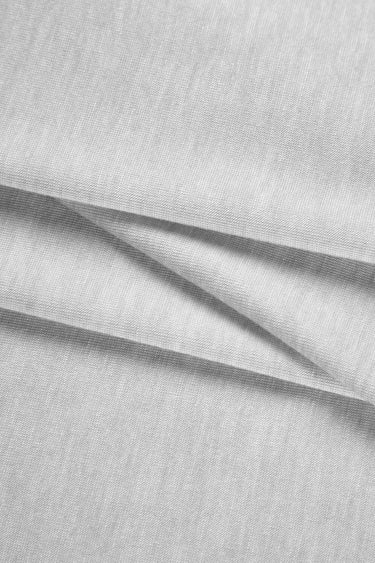 TENCEL wool blend stretch single jersey fabric close-up with diagonal fold detail and soft texture for comfortable knit garments.