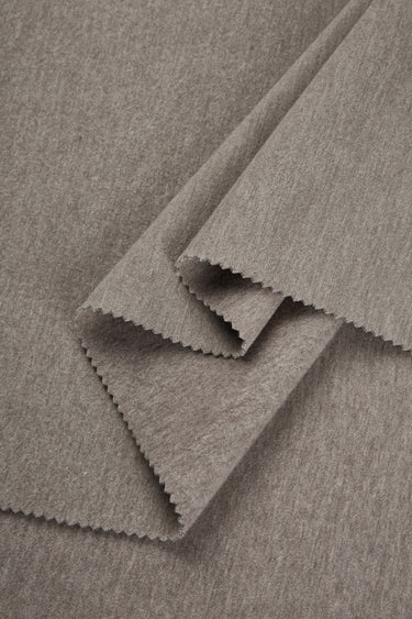 HEAT-FLOW fleece knit fabric close-up with folded edge detail for hoodies and sweatshirts.