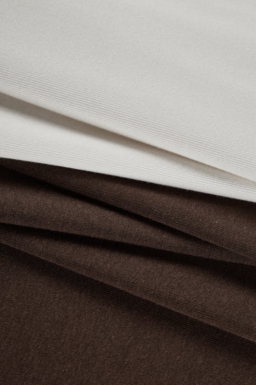 Mousse rib knit fabric close-up with layered edge detail for modern casualwear and knit garments.