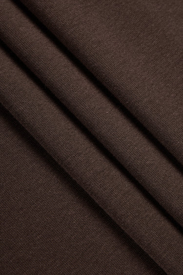 Mousse rib knit fabric close-up with soft surface fold detail for casualwear and comfortable knit garments.