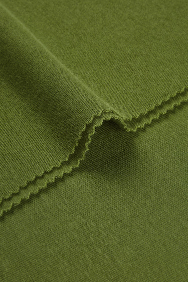 Merino cashmere blend mousse knit fabric close-up with edge structure detail and soft micro-fleece texture for casualwear.