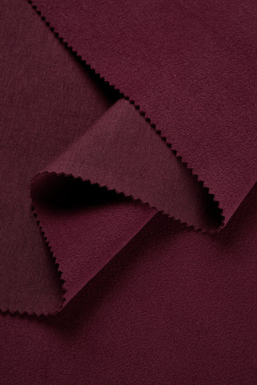 HEAT-FLOW fleece knit fabric close-up with folded edge detail for hoodies and sweatshirts.