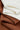 HEAT-FLOW fleece knit fabric close-up with backing fold detail for warm hoodies and thermal tops.