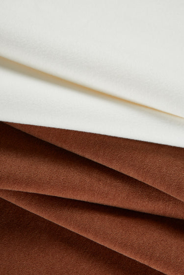 HEAT-FLOW fleece knit fabric close-up with layered fold detail for hoodies and sweatshirts.