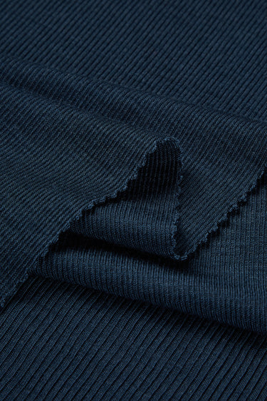 TENCEL wool blend rib knit fabric close-up with edge structure detail for base layers and next-to-skin garments.
