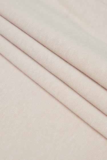TENCEL linen blend stretch rib knit fabric close-up with layered fold detail for lightweight tops and summer knitwear.