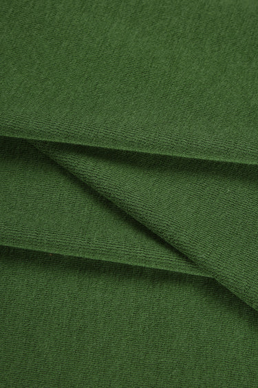 Merino wool blend mousse knit fabric close-up with diagonal fold detail and soft texture for modern casualwear.