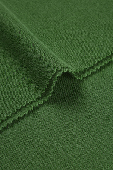 Merino wool blend mousse knit fabric close-up with edge structure detail and soft micro-fleece texture for casualwear.