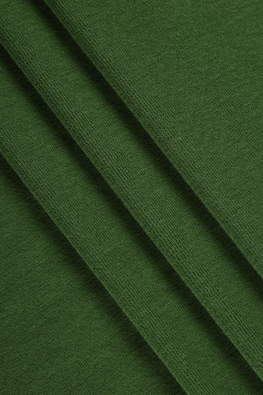 Merino wool blend mousse knit fabric close-up with surface fold detail and smooth hand feel for comfortable knit garments.