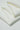 Sand-washed interlock fleece knit fabric close-up with folded stack detail and refined texture for everyday lifestyle garments.