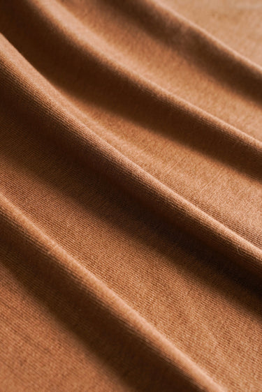 TENCEL wool blend stretch rib knit fabric close-up with surface fold detail and soft dry touch for base layers and everyday knitwear.