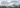 Lightweight white fabric floating above a misty forest, symbolizing sustainable textile innovation.