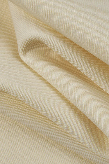 Cotton spandex stretch rib knit fabric close-up with surface fold detail and natural breathability for garments worn close to the body.