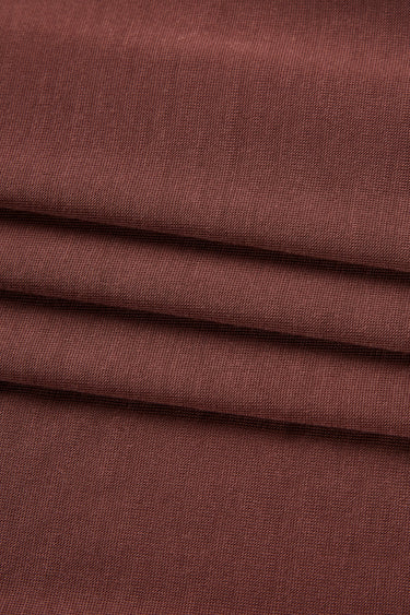 Lenzing TENCEL Lyocell single jersey fabric close-up with surface fold detail and smooth touch for breathable warm-weather garments.