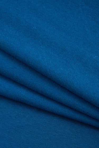Mousse rib knit fabric close-up with smooth surface texture and soft hand feel for casual knitwear.