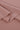 Viscose-covered filament single jersey fabric close-up with folded edge detail and smooth hand feel for base layers and everyday knit garments.