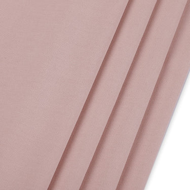 Viscose polyester single jersey fabric close-up with surface fold detail and smooth hand feel for versatile everyday garments.