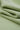 Cotton polyester interlock knit fabric close-up with folded drape detail for transitional apparel and everyday knitwear.