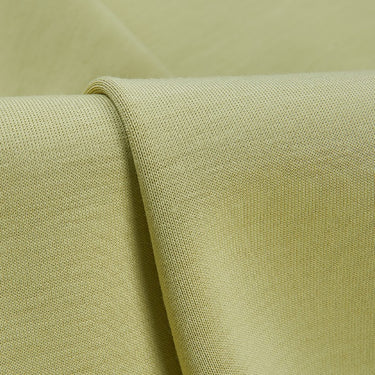 Double-face SCUBA air-layer knit fabric close-up with folded edge detail and stable structure for premium casual garments.