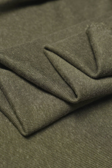 TENCEL linen blend stretch rib knit fabric close-up with layered fold detail for resort garments and relaxed everyday pieces.