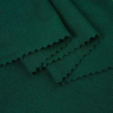 MIYABI acrylic cashmere stretch rib knit fabric close-up with folded edge detail and soft hand feel for refined casualwear.