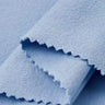 Cotton polyester textured mesh knit fabric close-up with layered edge detail and structured surface for sweatshirts and transitional apparel.