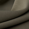 Jelly air-layer SCUBA knit fabric close-up with surface drape detail and structured comfort for everyday garments.
