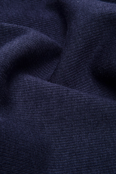 Viscose cotton spandex stretch rib knit fabric close-up with surface drape detail and comfortable stretch for modern apparel production.