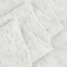 Ecocosy textured double-face step knit fabric close-up with layered fold detail and soft surface for transitional garments and structured knitwear.