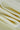 Double-sided piqué knit fabric close-up with folded drape detail and breathable texture for casualwear and knit apparel.