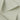 Rayon polyester cotton spandex small jacquard rib knit fabric close-up with layered fold detail and subtle textured surface for modern apparel styles.