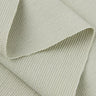 Rayon polyester cotton spandex small jacquard rib knit fabric close-up with layered fold detail and subtle textured surface for modern apparel styles.