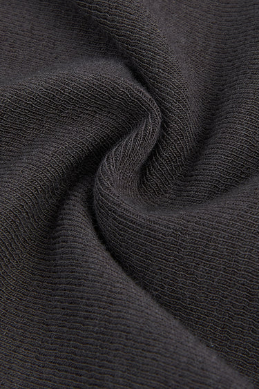 Mousse acrylic cashmere rib knit fabric close-up with twist detail and soft texture for casual knitwear and everyday comfort.