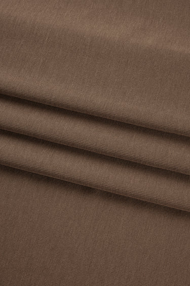 Rayon nylon blend stretch rib knit fabric close-up with surface fold detail and smooth hand feel for comfortable everyday apparel.