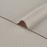 Viscose nylon spandex rib knit fabric close-up with edge structure detail and deep rib channels for fitted garments.